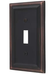 Georgian Single-Toggle Switch Plate in Aged Bronze.